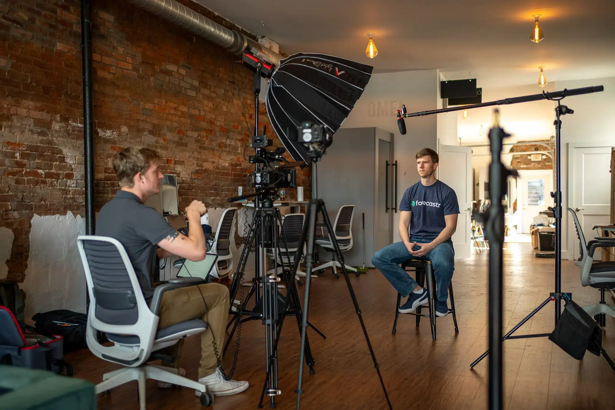 "Jacob Nobbe and Ethan Wang setting up a shoot for Forecastr at a vibrant location in Cincinnati.